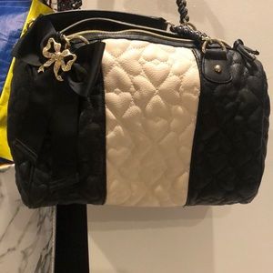 Betsy Johnson original purse comes with a longer arm strap